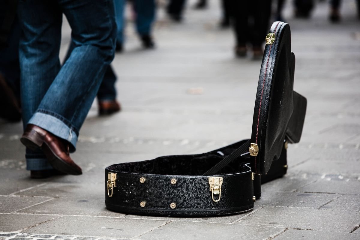Black ABS hard case for a dreadnought acoustic guitar, open with metal latches