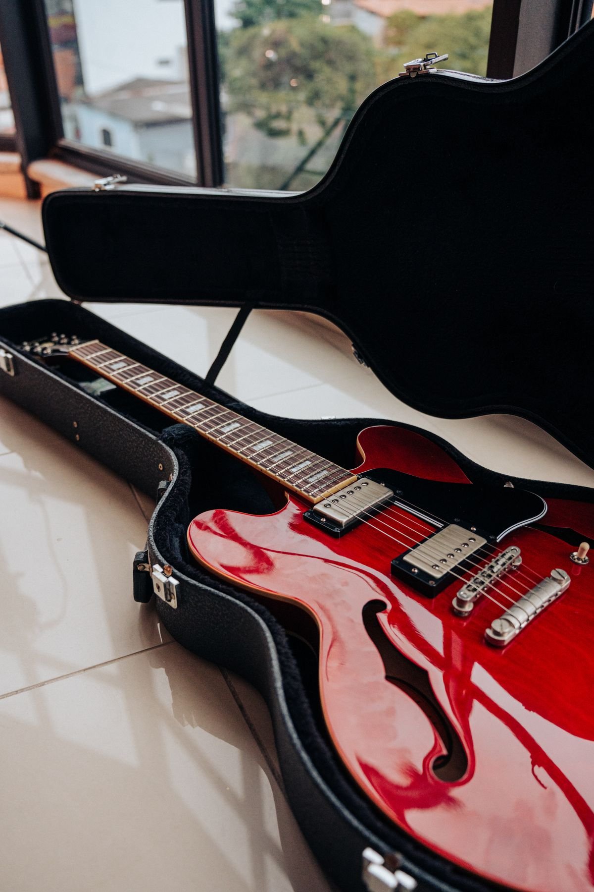 Foam-lined shell case for an electric guitar, shown open