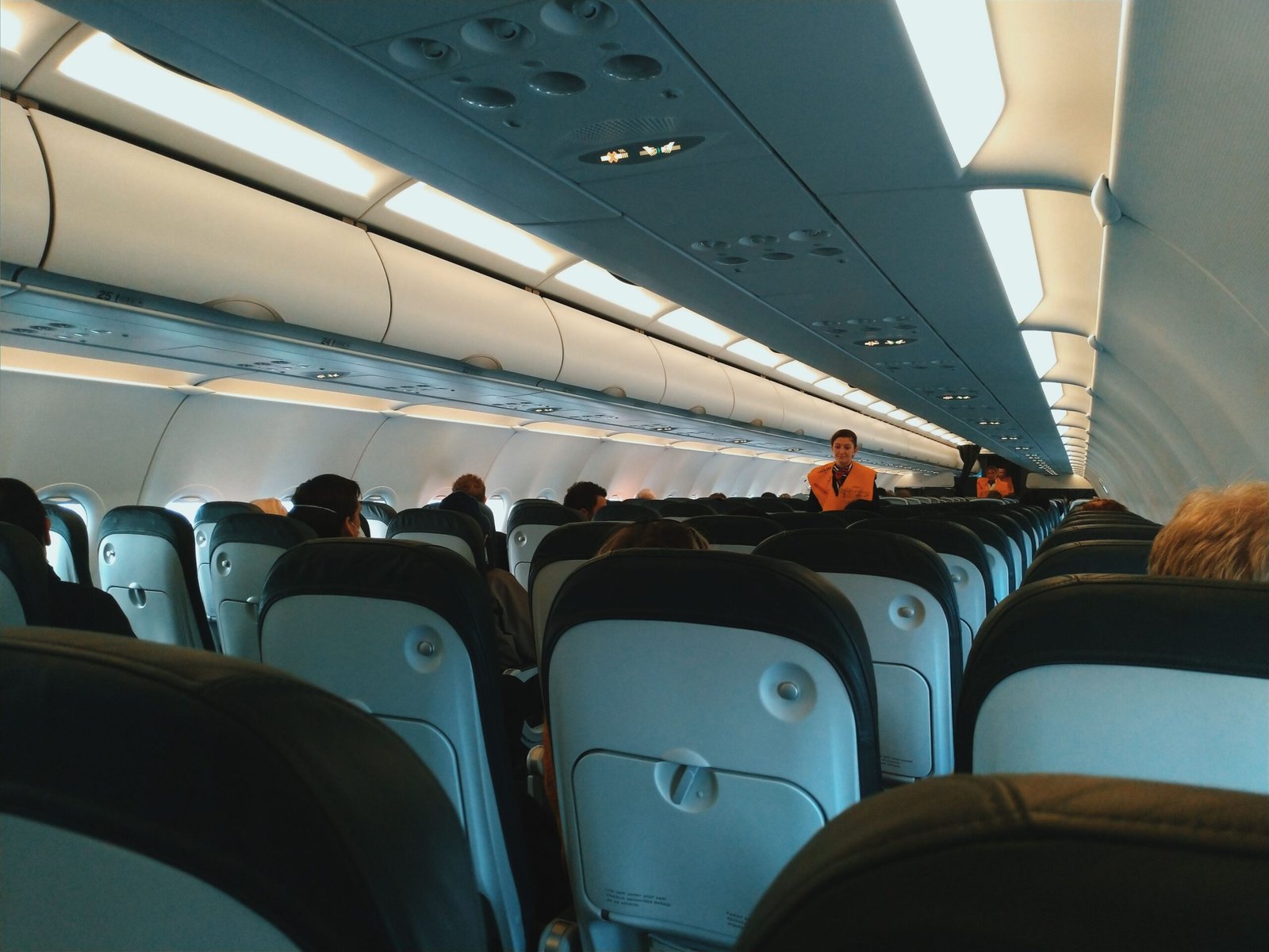 Aircraft cabin with overhead lockers, relevant to guitar cabin baggage rules