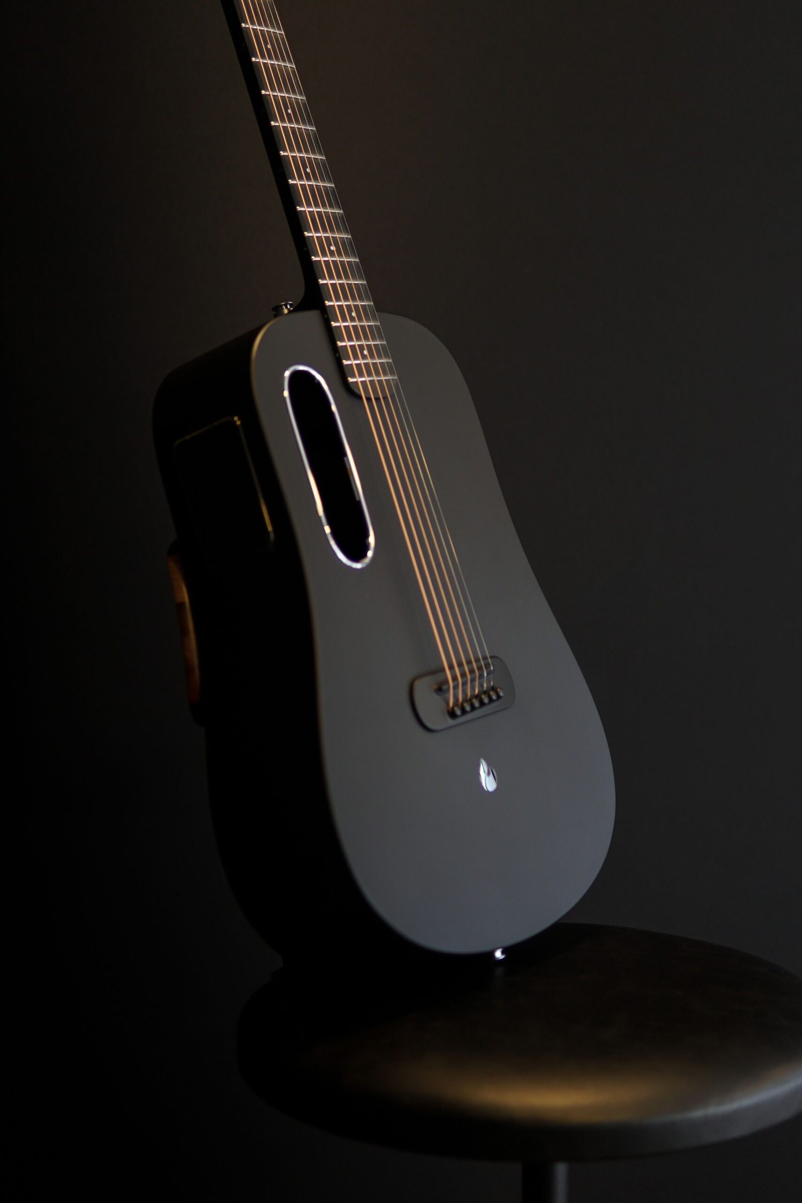 Matte black composite-style guitar body