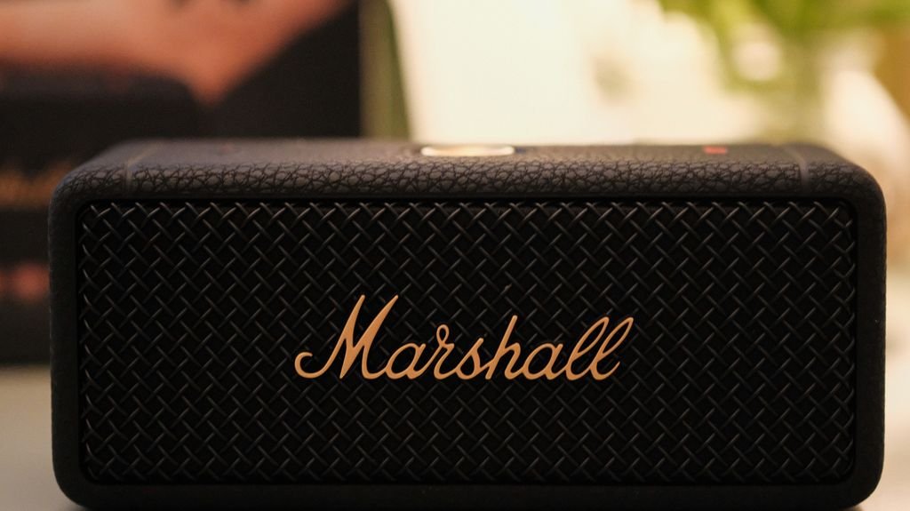 Small black portable Bluetooth amp/speaker unit, similar size to the Positive Grid Spark GO