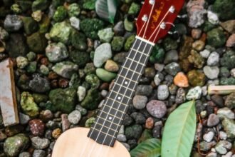 Small nylon-string travel instrument similar in body shape to the Yamaha GL1 Guitalele