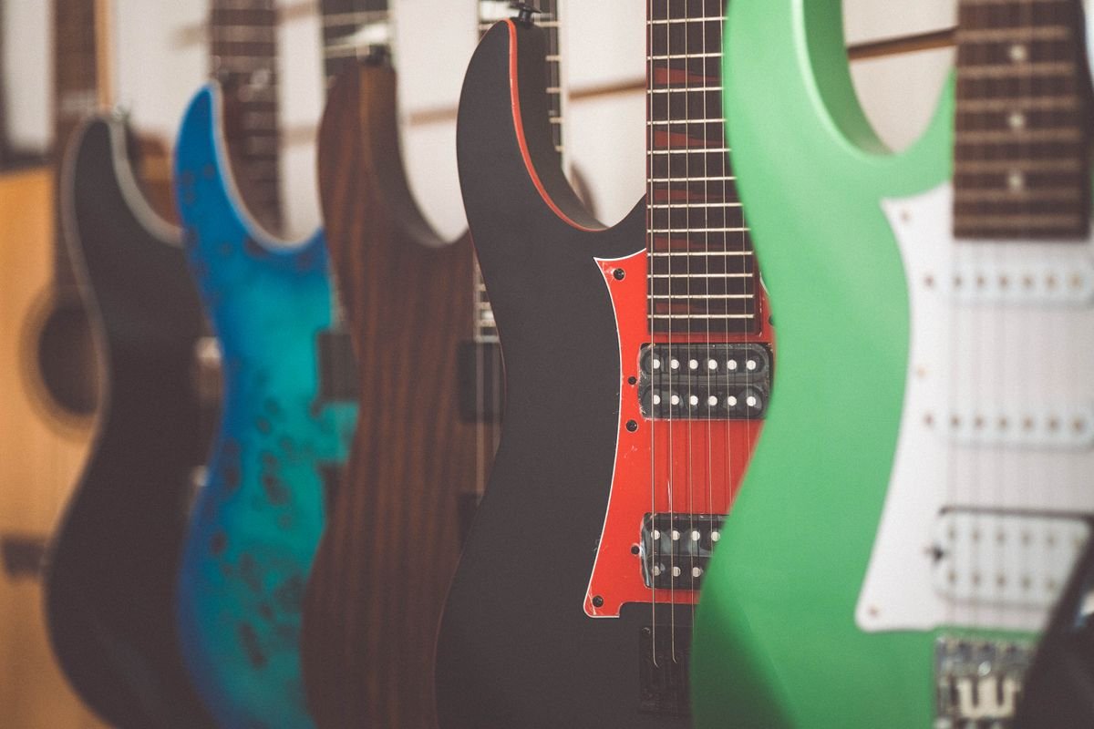 A row of electric guitars in a shop