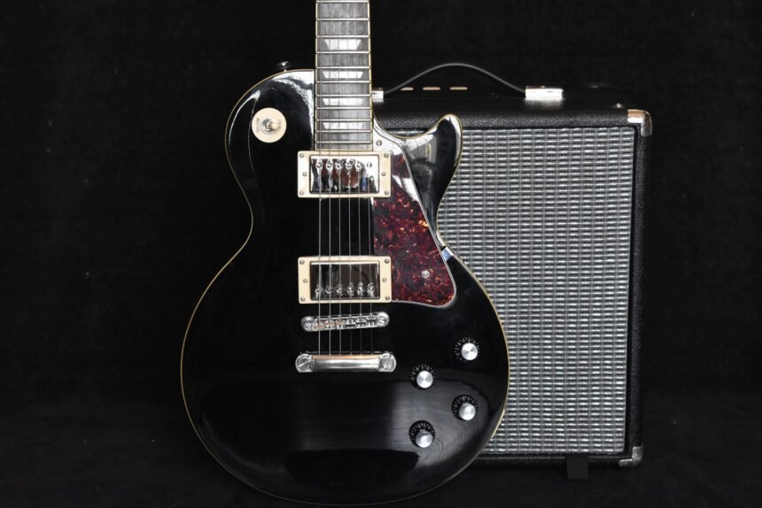 Close-up of a solid-body electric guitar with dual humbucker pickups, similar in layout to the Ibanez Gio miKro