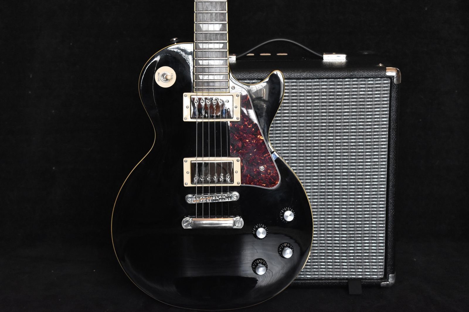 Close-up of a solid-body electric guitar with dual humbucker pickups, similar in layout to the Ibanez Gio miKro