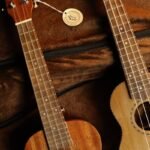 Two guitarlele necks with fretboard binding, similar to the Ortega Mini Travel Series