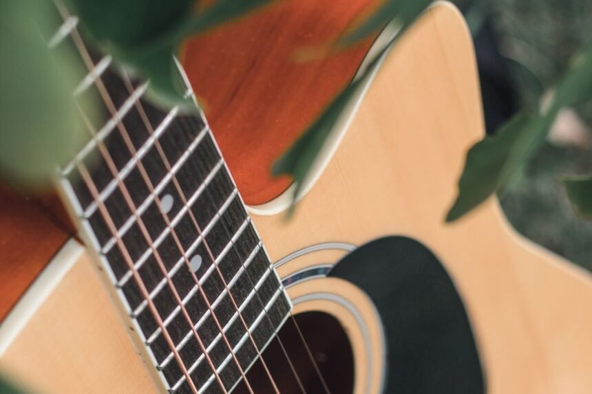 Natural gloss spruce top and rosewood fretboard detail on a 3/4-size travel acoustic, similar in finish to the Yamaha JR1
