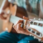 do travel guitars sound worse fretting hand closeup