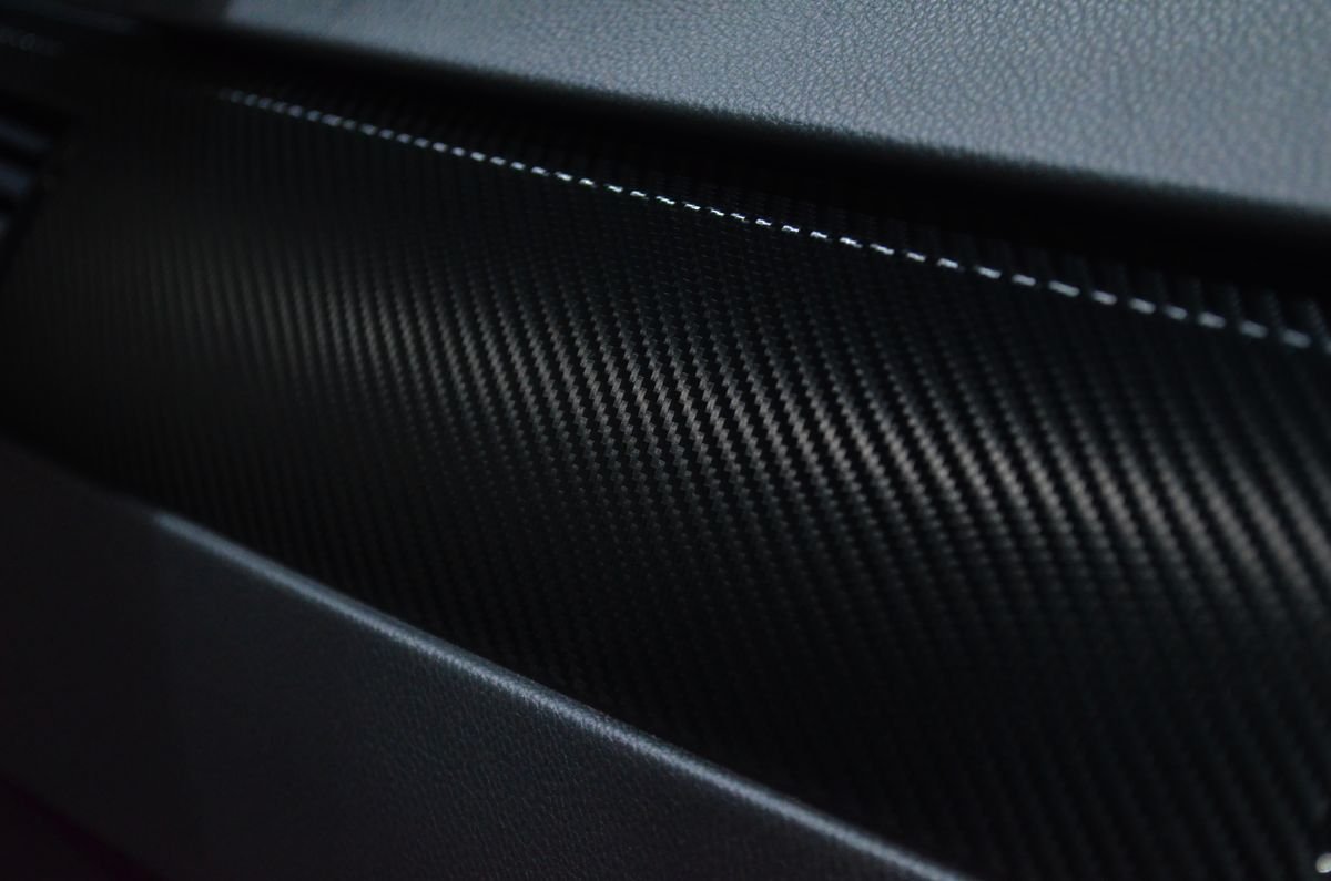 Close-up of woven carbon fibre material, the same construction used in travel guitar bodies