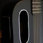 Close-up of a sleek, modern carbon-fibre guitar body and soundhole, illustrating the LAVA ME Air's design