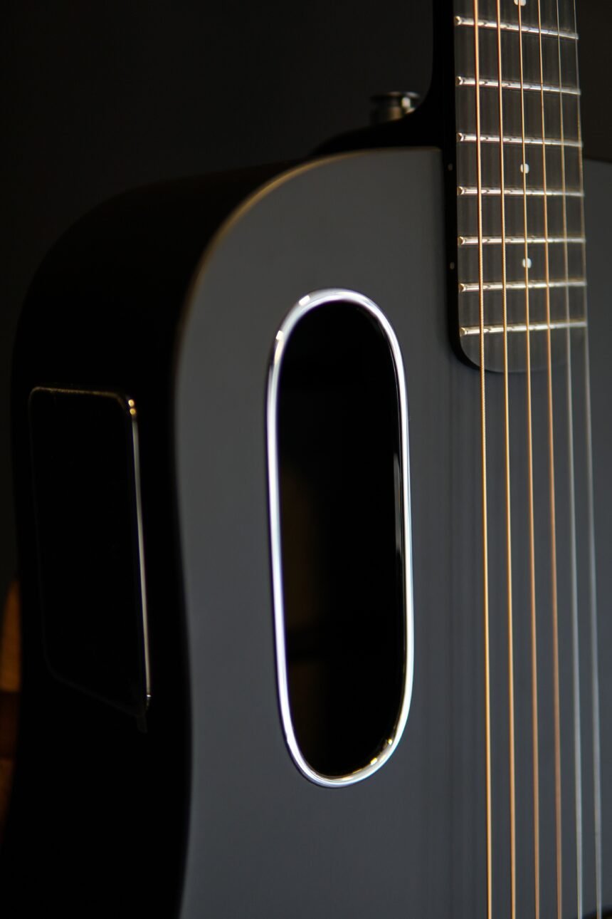 Close-up of a sleek, modern carbon-fibre guitar body and soundhole, illustrating the LAVA ME Air's design